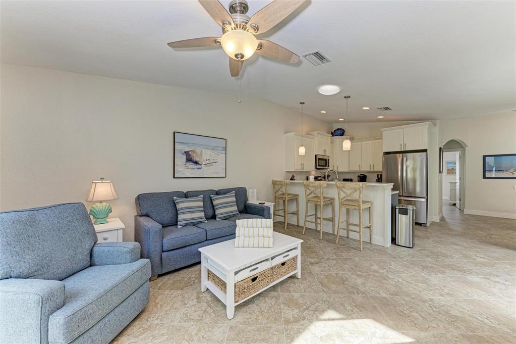 308 58th Street, Unit A Holmes Beach, FL 34217 - Photo 5 of 41 a living room with furniture and kitchen view