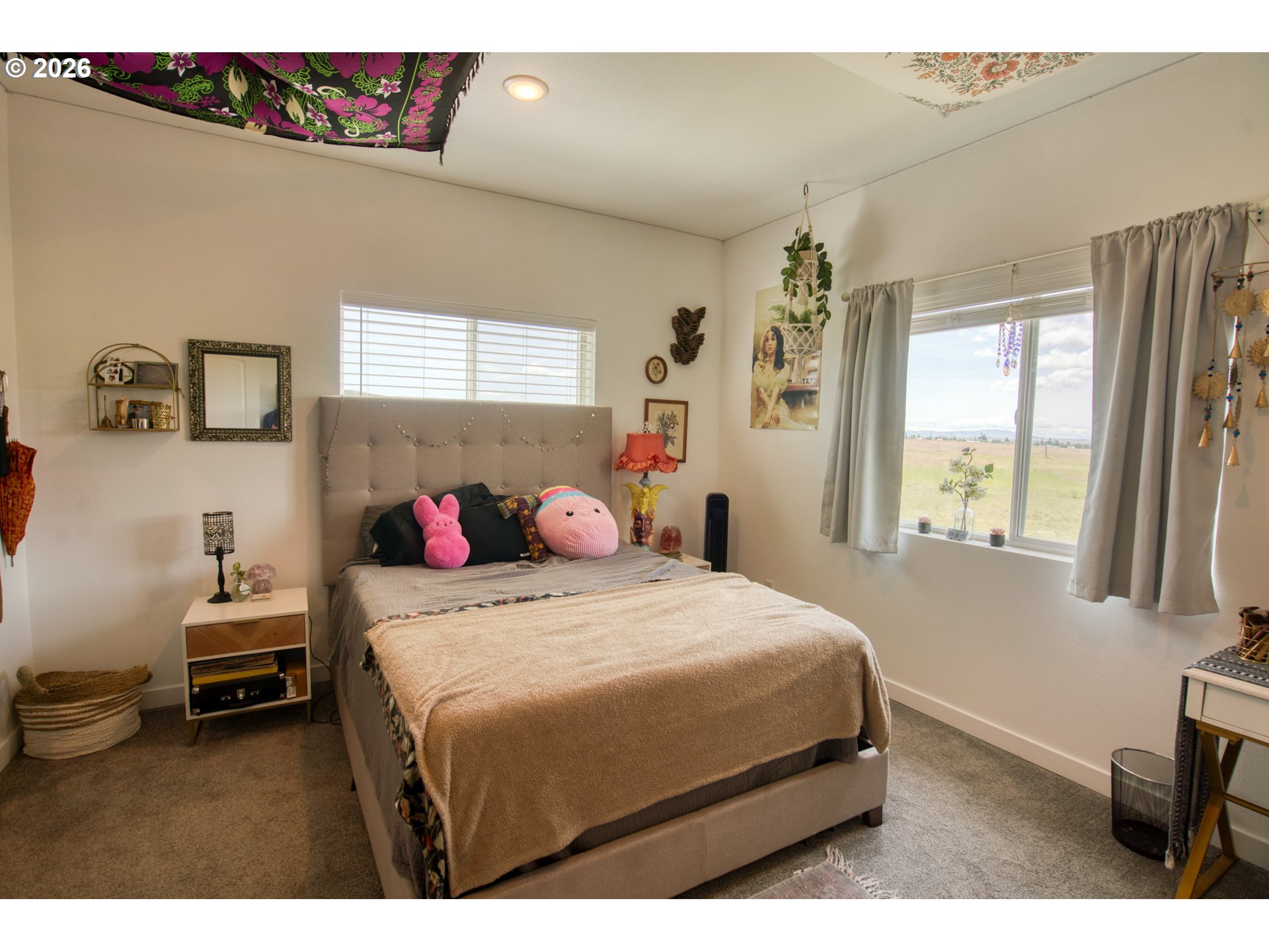 19 Inverness Road Goldendale, WA 98620 - Photo 32 of 48 a bedroom with a bed a dresser and a window