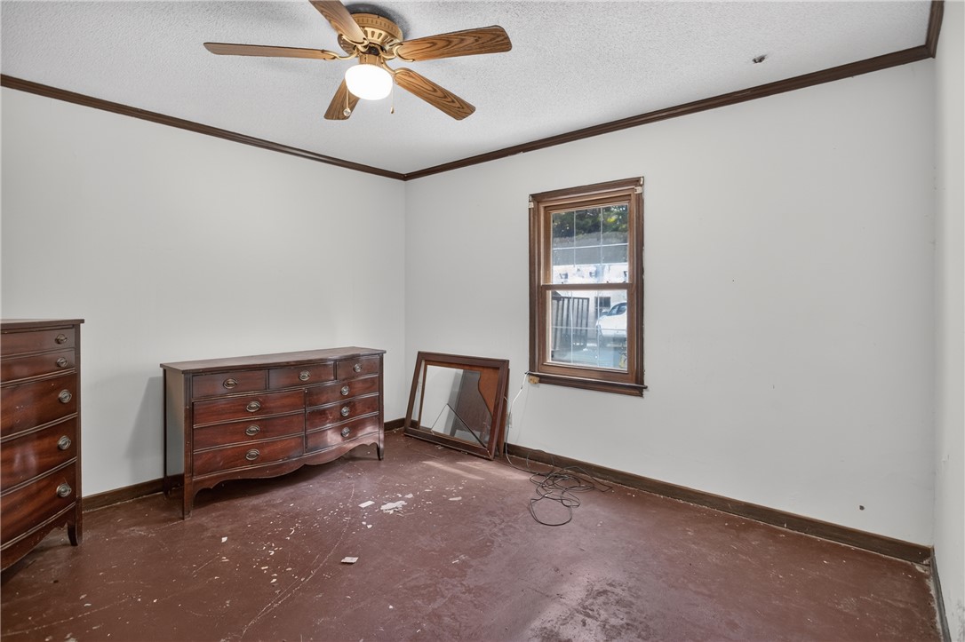 1719 Old Central Road Central, SC 29630 - Photo 33 of 45 Dark wood trim accents the walls and window frame in this blank canvas space.
