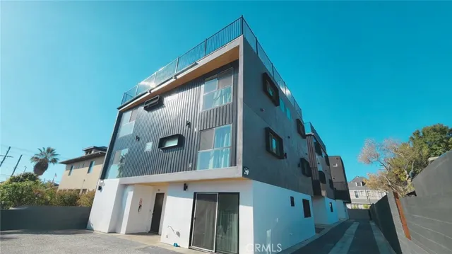 a view of a house with a tree