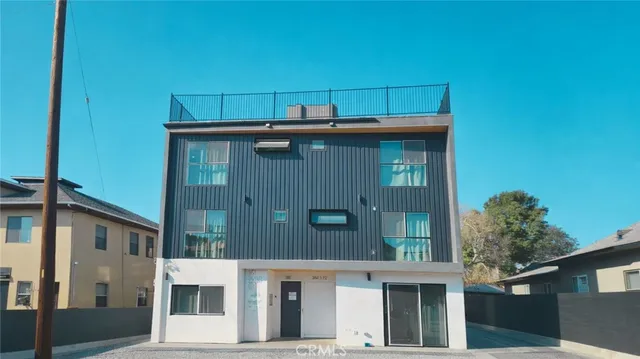 a view of a house with large windows