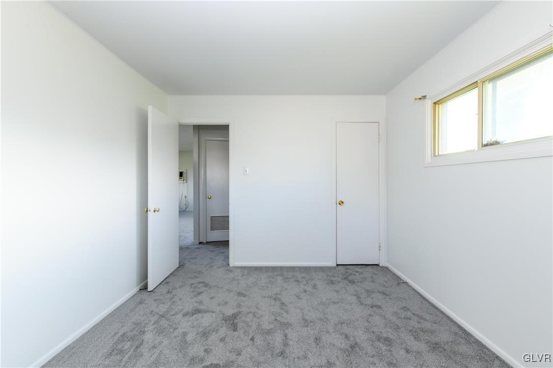 25 Saylor Drive Coplay, PA 18037 - Photo 12 of 20 an empty room with windows and closet