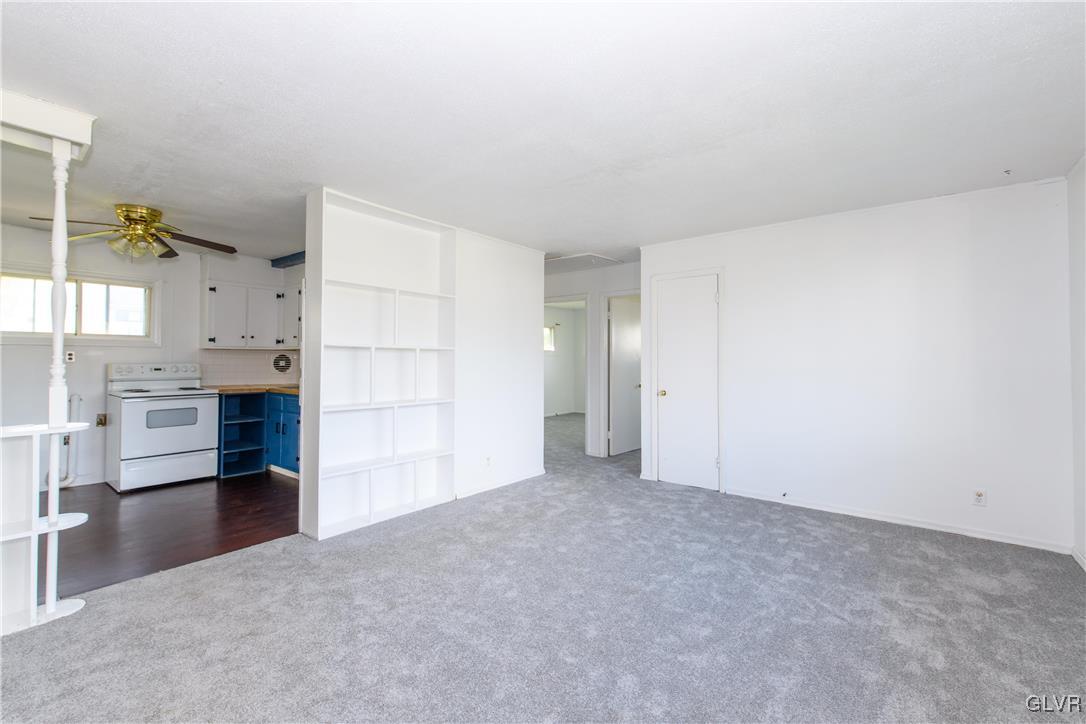 25 Saylor Drive Coplay, PA 18037 - Photo 2 of 20 a view of empty room with kitchen and window