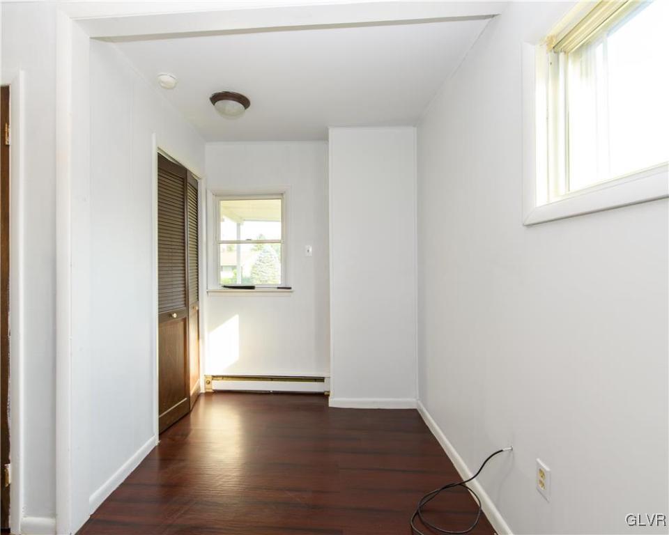 25 Saylor Drive Coplay, PA 18037 - Photo 8 of 20 an empty room with wooden floor and windows