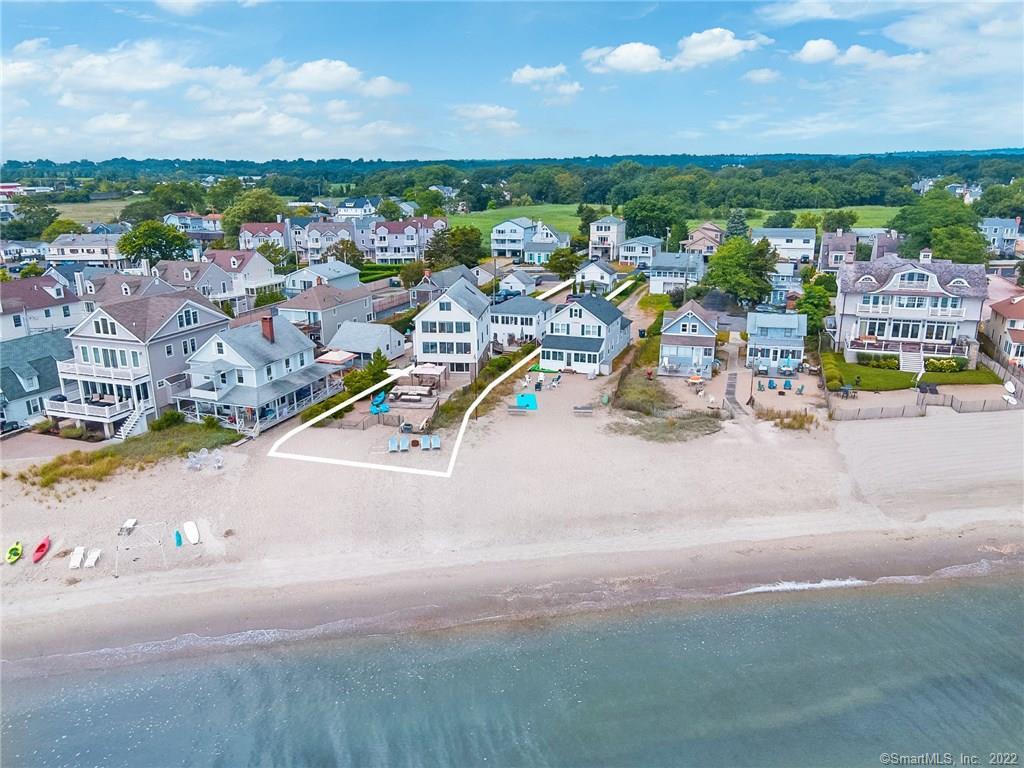 Direct beachfront property with three homes.