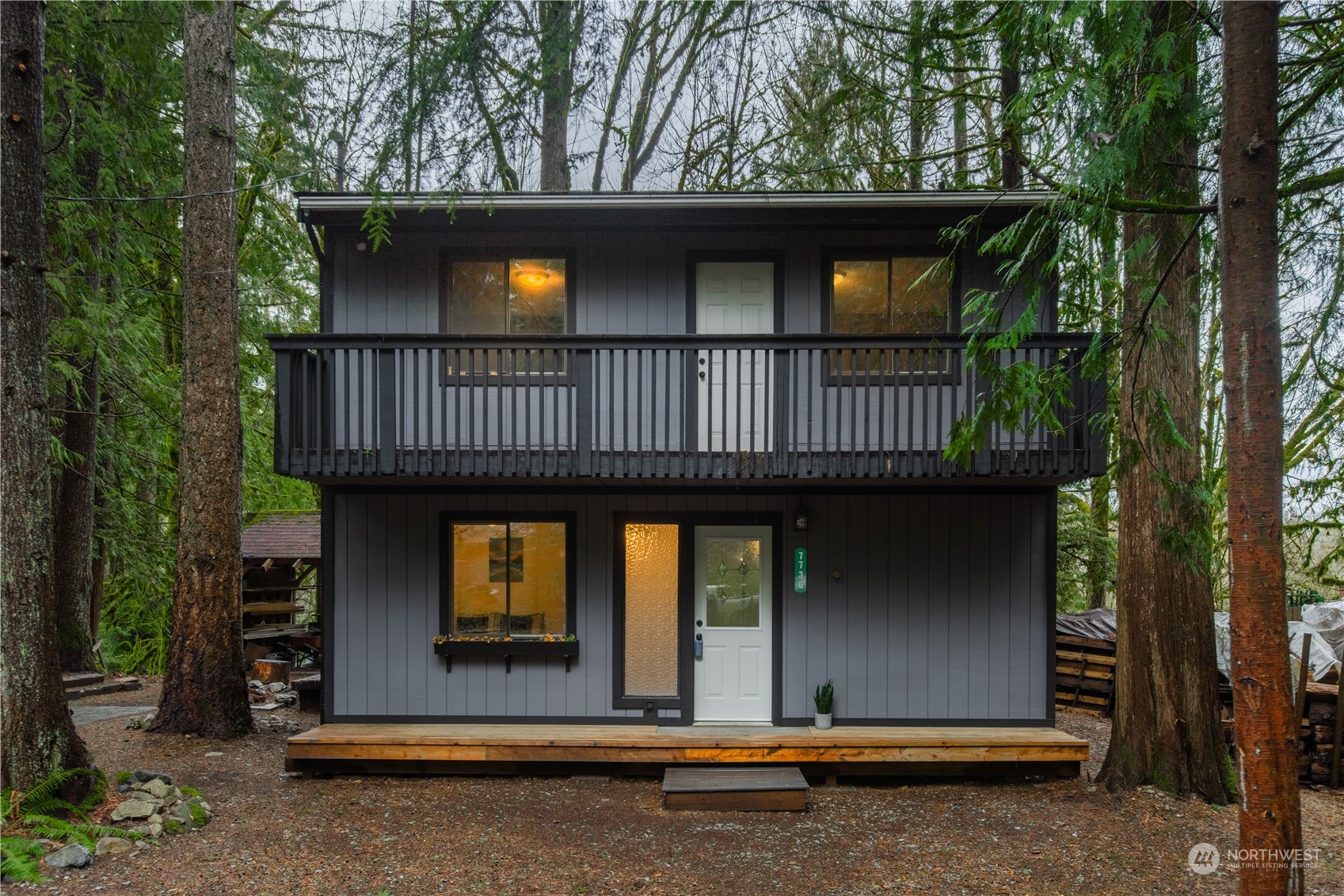 7736 View Ridge Drive Maple Falls, WA 98266 - Photo 1 of 25 a front view of a house with a garden