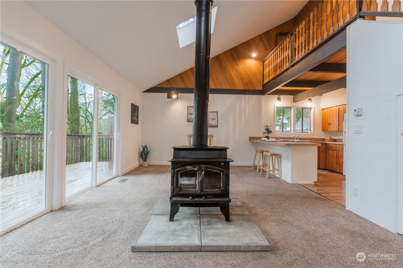 7736 View Ridge Drive Maple Falls, WA 98266 - Photo 11 of 25 a living room with furniture a lamp and a table