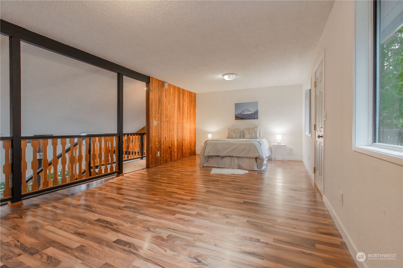 7736 View Ridge Drive Maple Falls, WA 98266 - Photo 13 of 25 a view of empty room with wooden floor and fan
