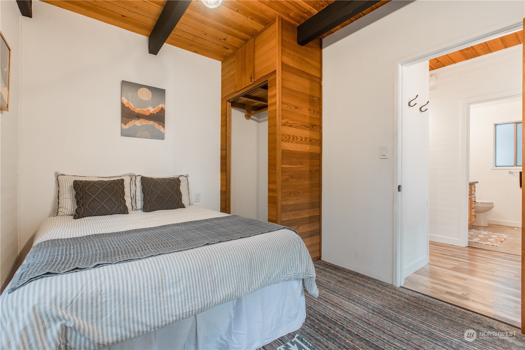 7736 View Ridge Drive Maple Falls, WA 98266 - Photo 20 of 25 a bedroom with a bed and wooden floor