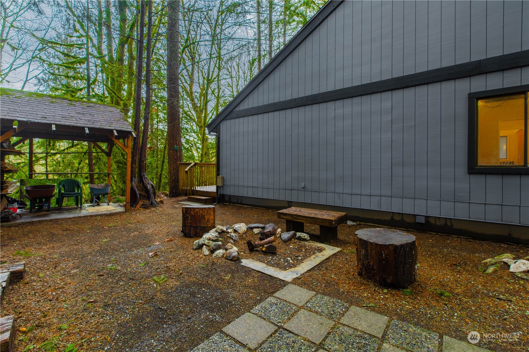 7736 View Ridge Drive Maple Falls, WA 98266 - Photo 21 of 25 a backyard of a house with barbeque oven table and chairs