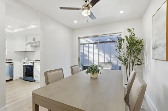 a dining room with furniture and window
