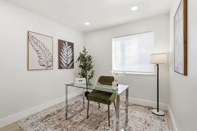 a workspace with furniture and a window