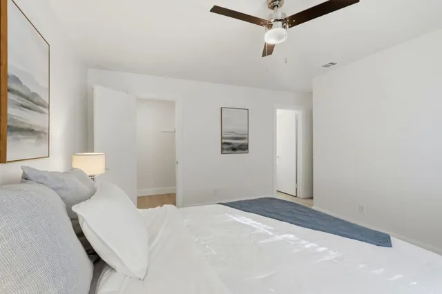 a bedroom with a bed and window