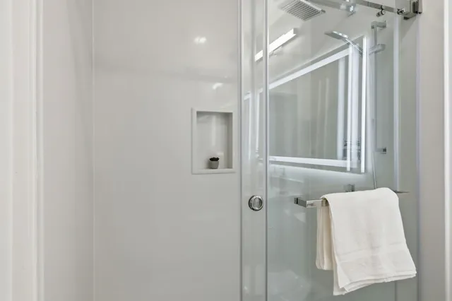 a bathroom with a shower and tub
