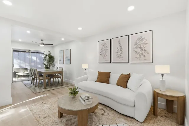 a living room with furniture and a table