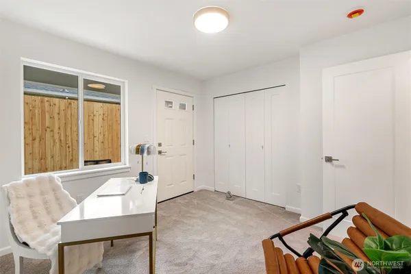 a view of a livingroom with furniture and windows