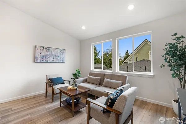 a living room with furniture and a window