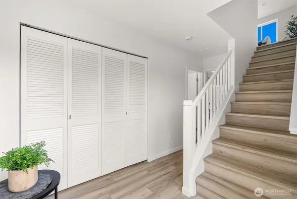 a view of entryway with wooden floor