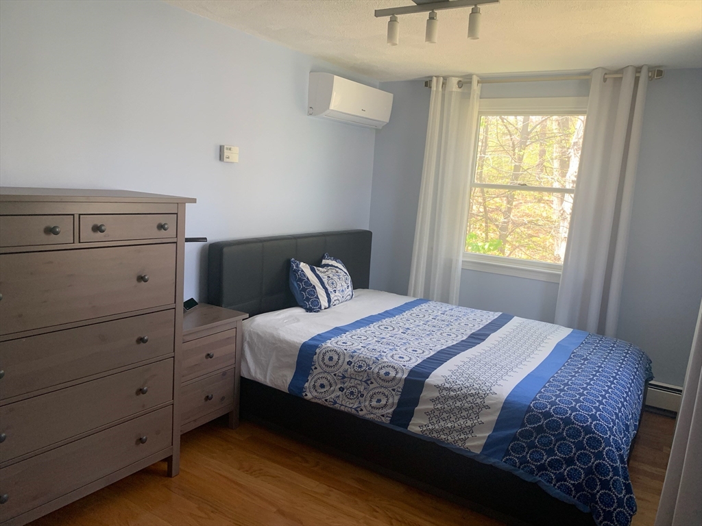 31 Hunnewell Street, Unit 31 Needham, MA 02494 - Photo 16 of 21 a bedroom with a bed and a window