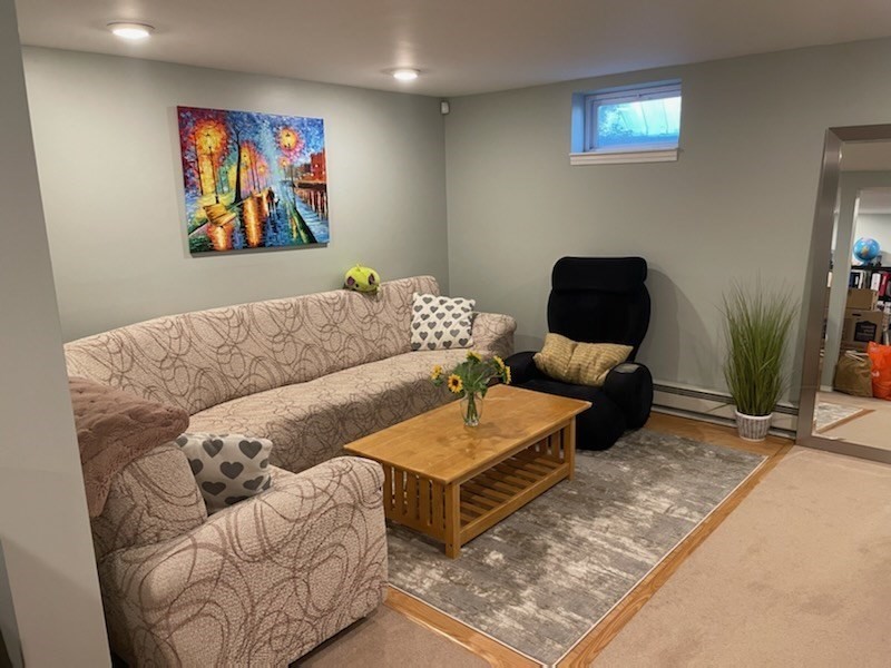 31 Hunnewell Street, Unit 31 Needham, MA 02494 - Photo 17 of 21 a living room with furniture and a rug
