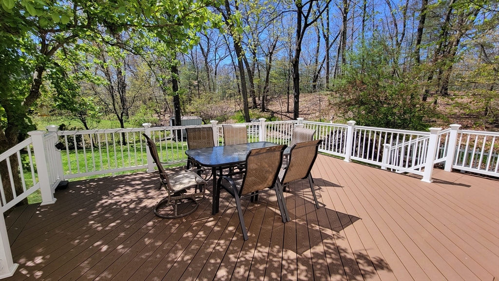 31 Hunnewell Street, Unit 31 Needham, MA 02494 - Photo 9 of 21 a view of a table and chairs in the patio