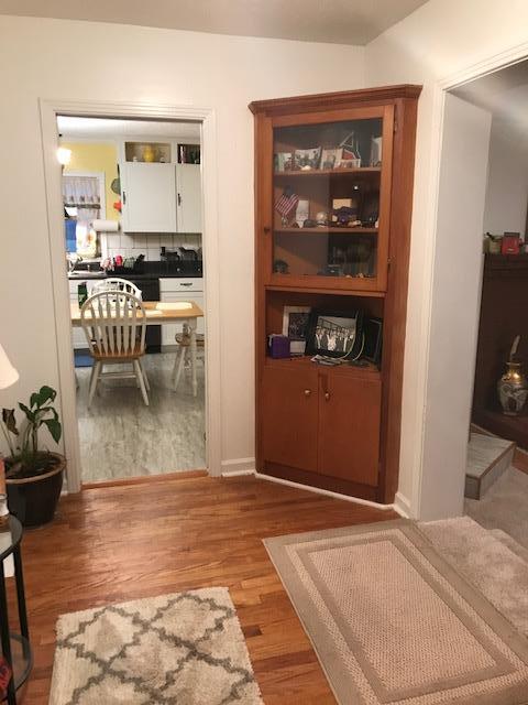 6833 North Pinson Road Portland, TN 37148 - Photo 4 of 18 a view of a hallway with wooden floor and a living room