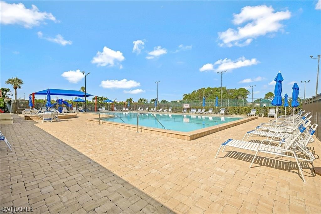 13285 Heather Ridge Loop Fort Myers, FL 33966 - Photo 36 of 47 a view of a swimming pool with an outdoor seating