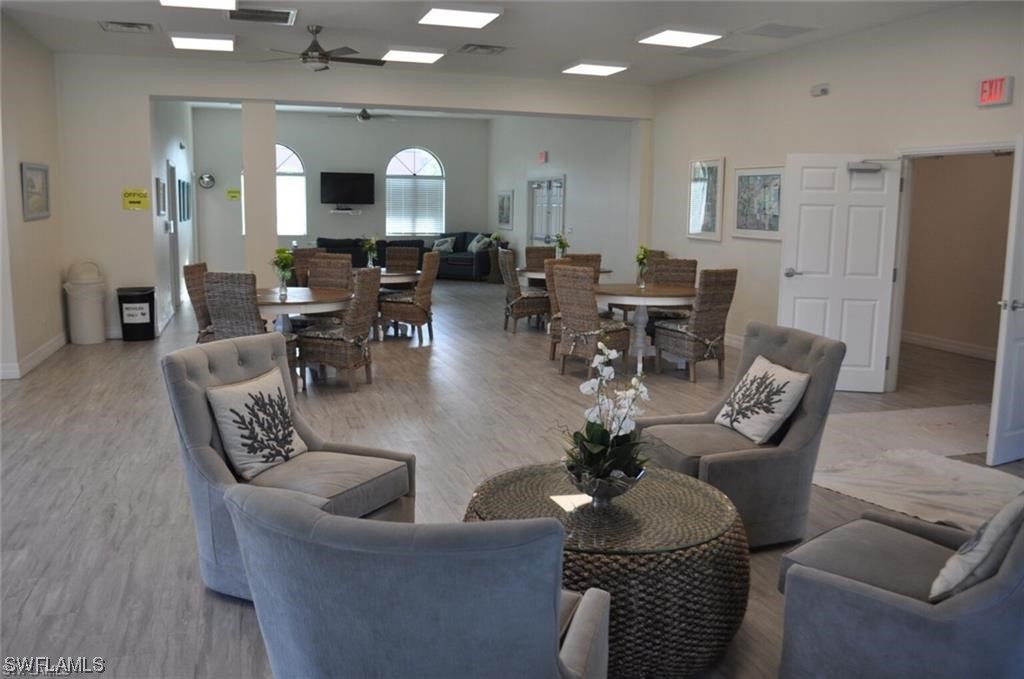 13285 Heather Ridge Loop Fort Myers, FL 33966 - Photo 39 of 47 a living room with furniture and wooden floor
