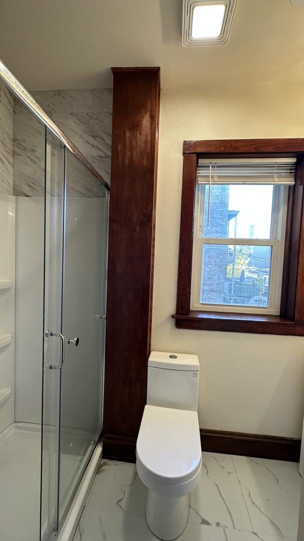 5530 North Artesian Avenue, Unit 1 Chicago, IL 60625 - Photo 14 of 16 a bathroom with a toilet and a shower