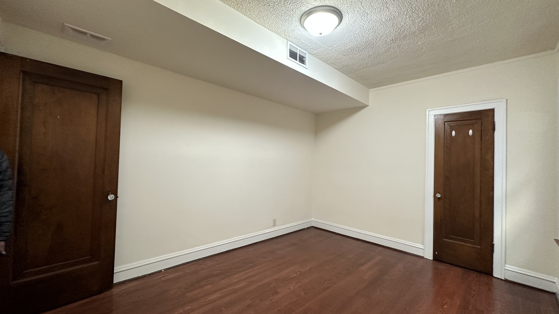 5530 North Artesian Avenue, Unit 1 Chicago, IL 60625 - Photo 9 of 16 an empty room with wooden floor and closet