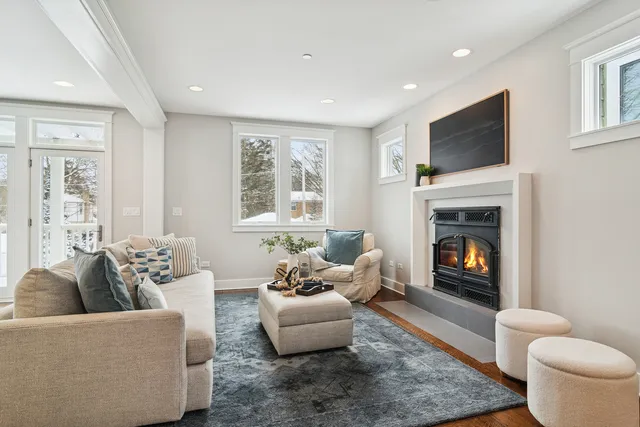 a living room with furniture flat screen tv and a fireplace