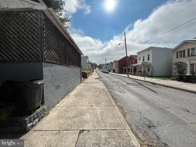 a view of a backyard with sitting area