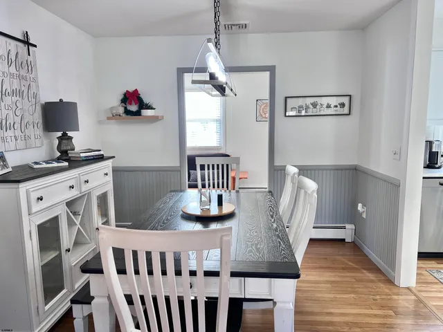 a view of kitchen with furniture and wooden floor