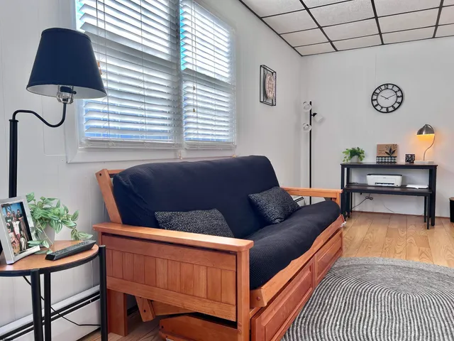 a living room with furniture and a window