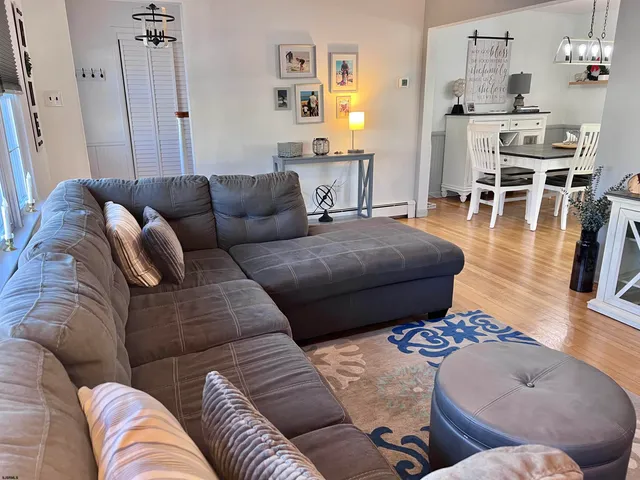 a living room with furniture and a table