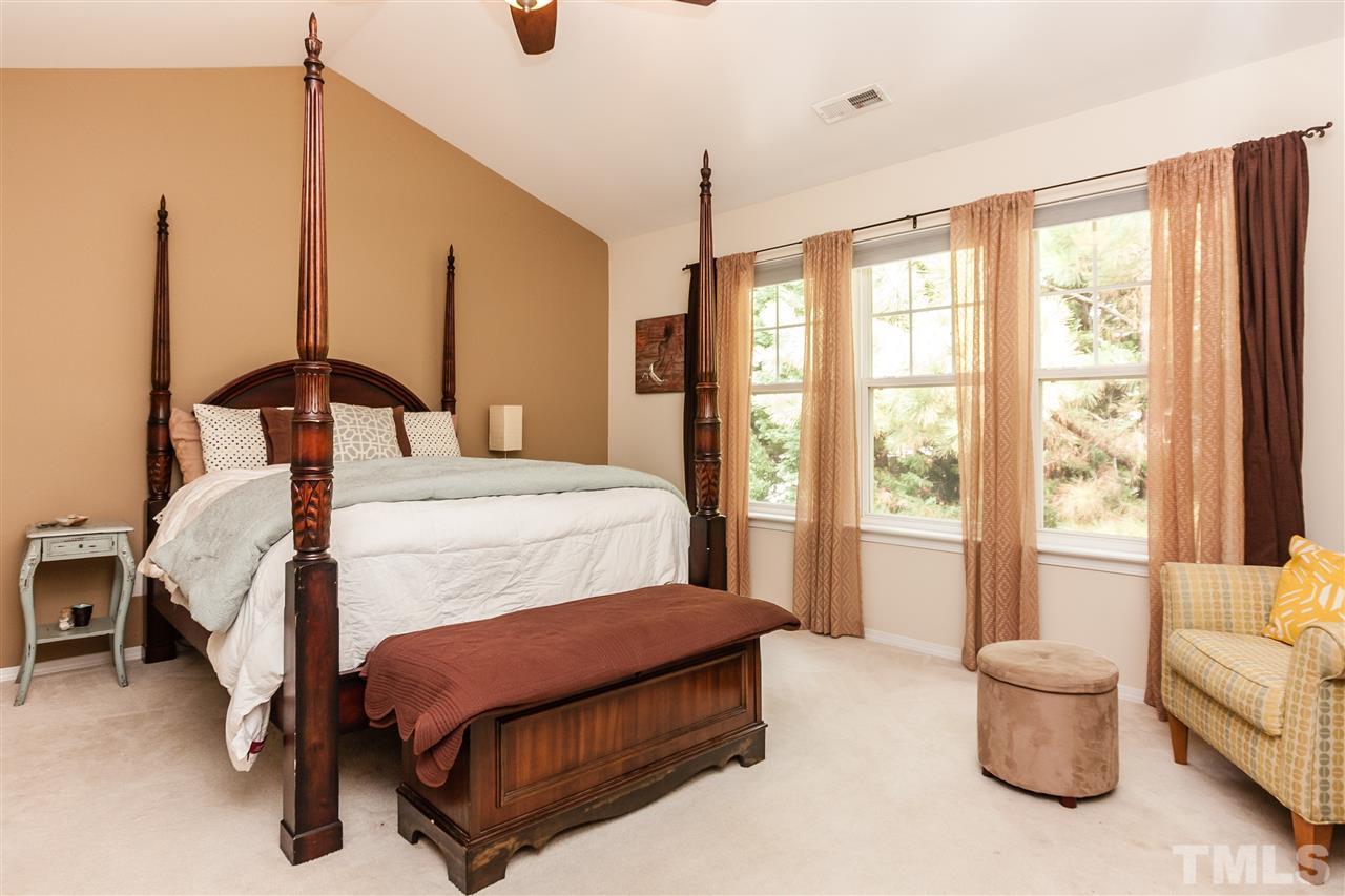 8500 Pillar Gate Lane Raleigh, NC 27613 - Photo 15 of 24 a bedroom with a bed and large window