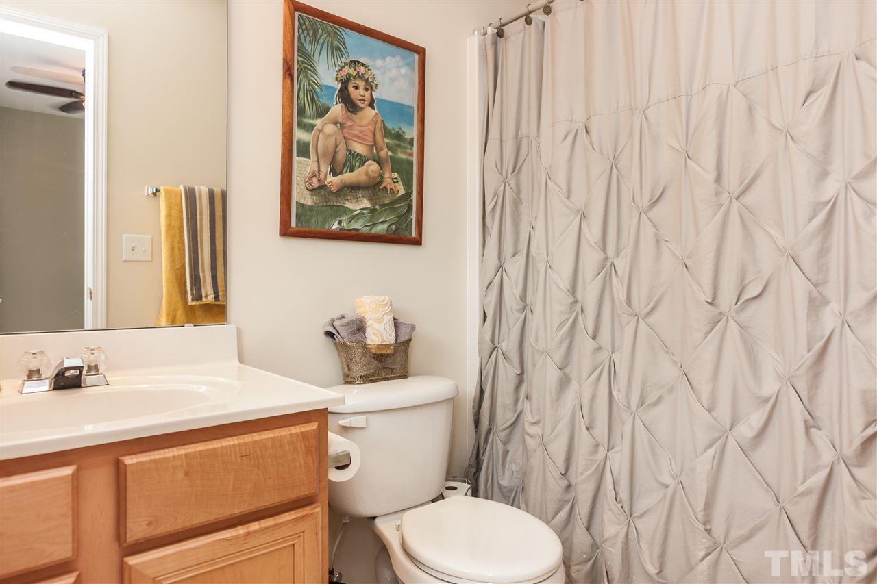 8500 Pillar Gate Lane Raleigh, NC 27613 - Photo 19 of 24 a white toilet sitting next to a bathroom sink