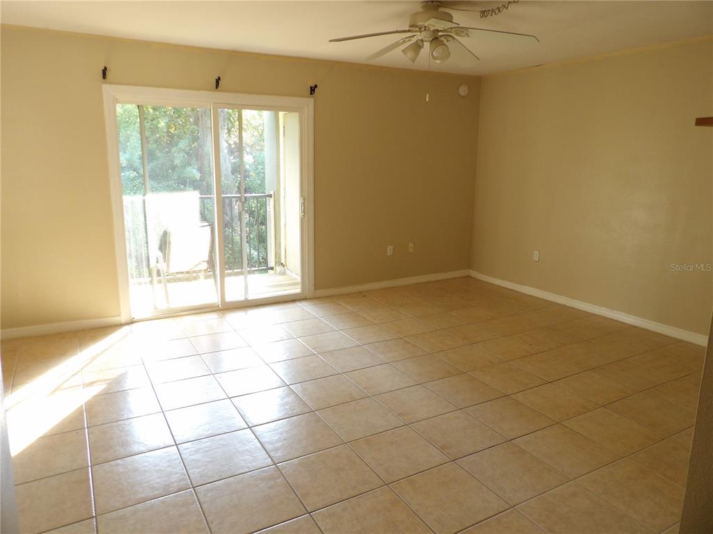 282 Scottsdale Square, Unit 282 Winter Park, FL 32792 - Photo 4 of 10 a view of an empty room with a window