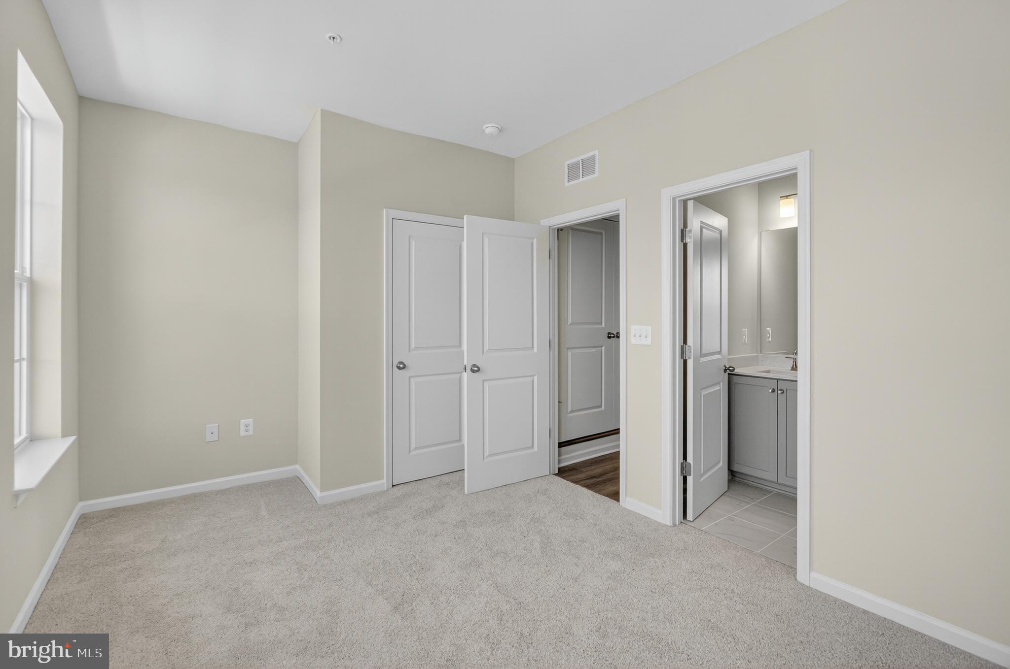 10046 Harper Vale Road Montgomery Village, MD 20886 - Photo 11 of 15 a view of an empty room with closet and a window