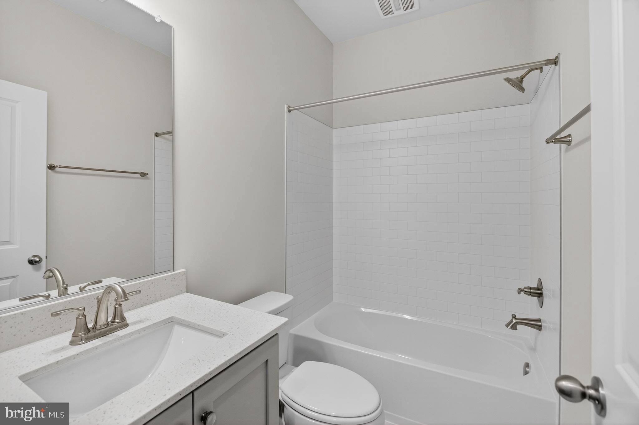 10046 Harper Vale Road Montgomery Village, MD 20886 - Photo 13 of 15 a bathroom with a sink toilet and shower