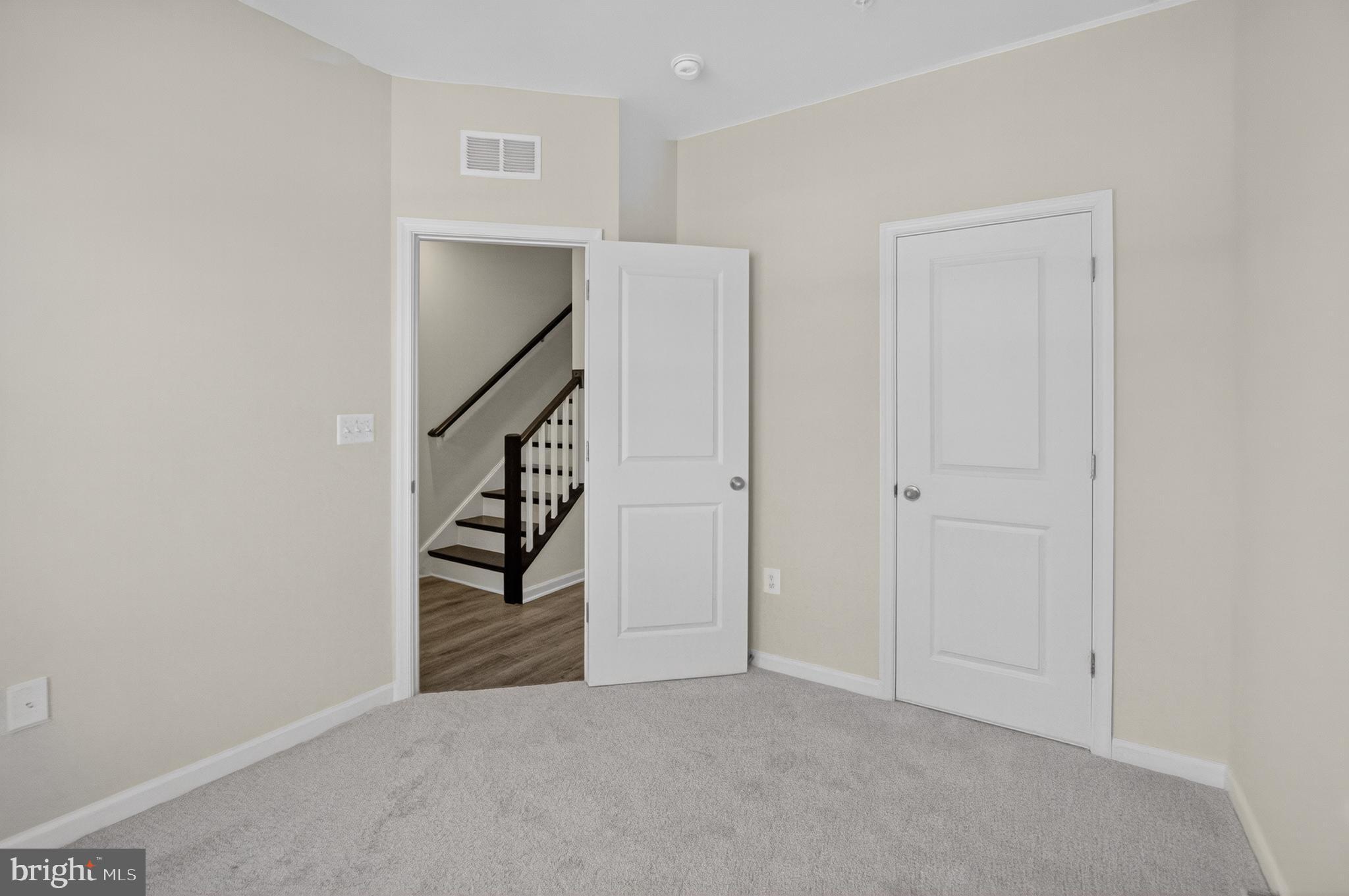 10046 Harper Vale Road Montgomery Village, MD 20886 - Photo 14 of 15 a view of an empty room with stairs