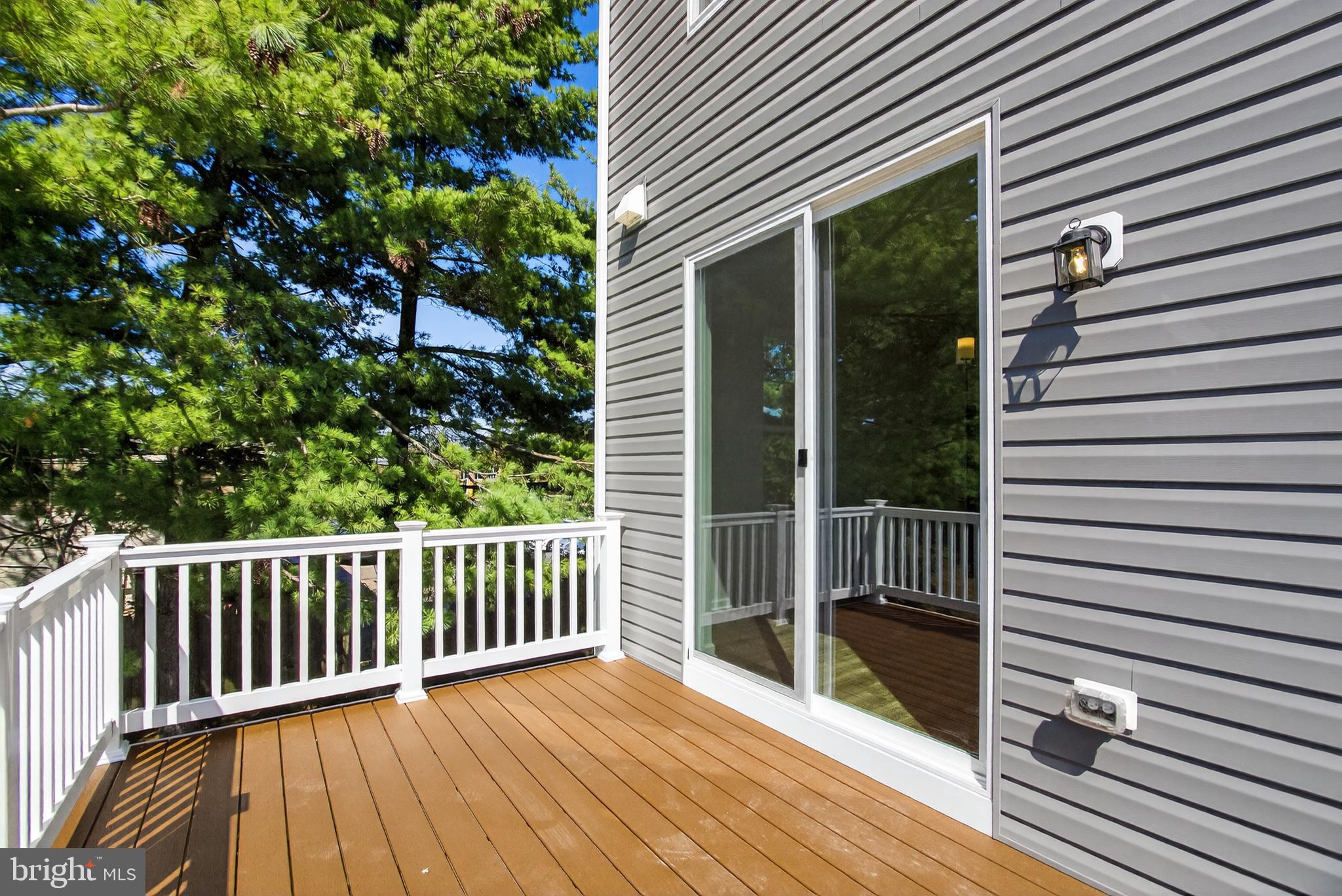 10046 Harper Vale Road Montgomery Village, MD 20886 - Photo 15 of 15 a view of backyard with a deck
