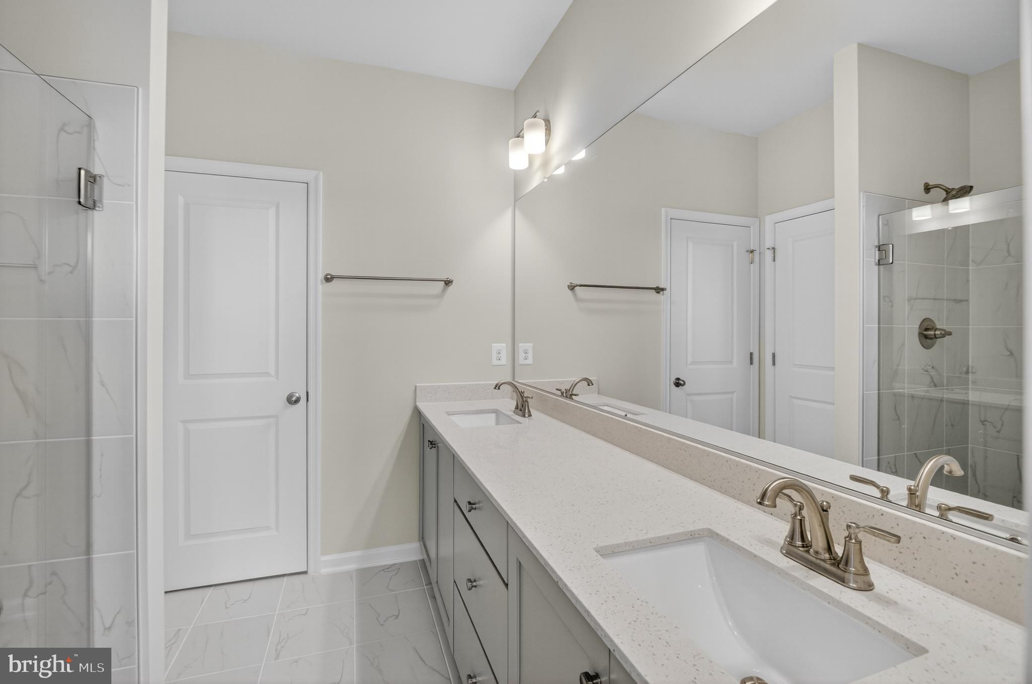 10046 Harper Vale Road Montgomery Village, MD 20886 - Photo 9 of 15 a bathroom with a sink and a mirror