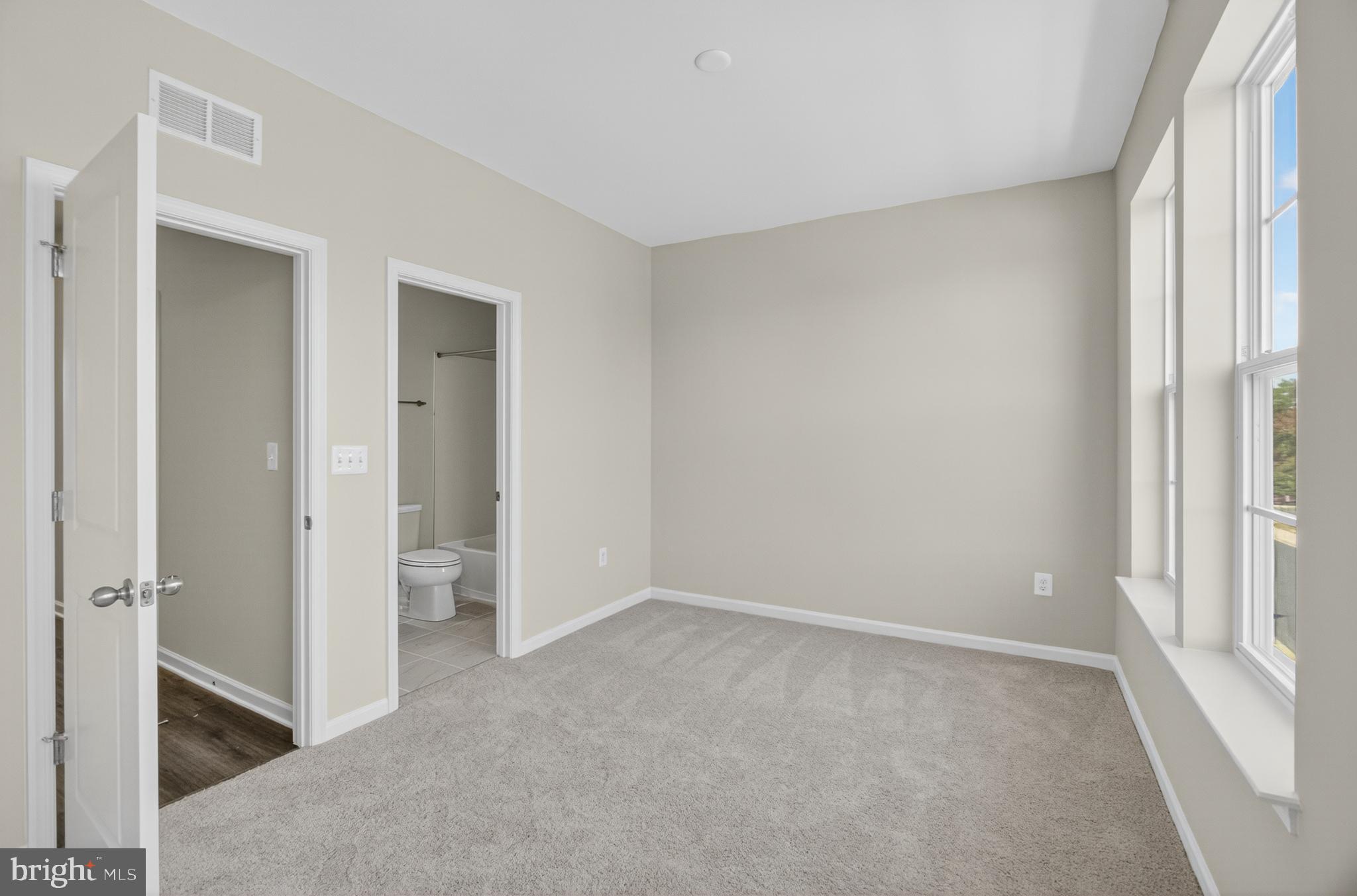 10046 Harper Vale Road Montgomery Village, MD 20886 - Photo 10 of 15 a view of an empty room with a window