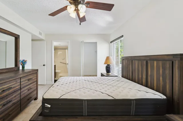 a view of a garden with a building in the background