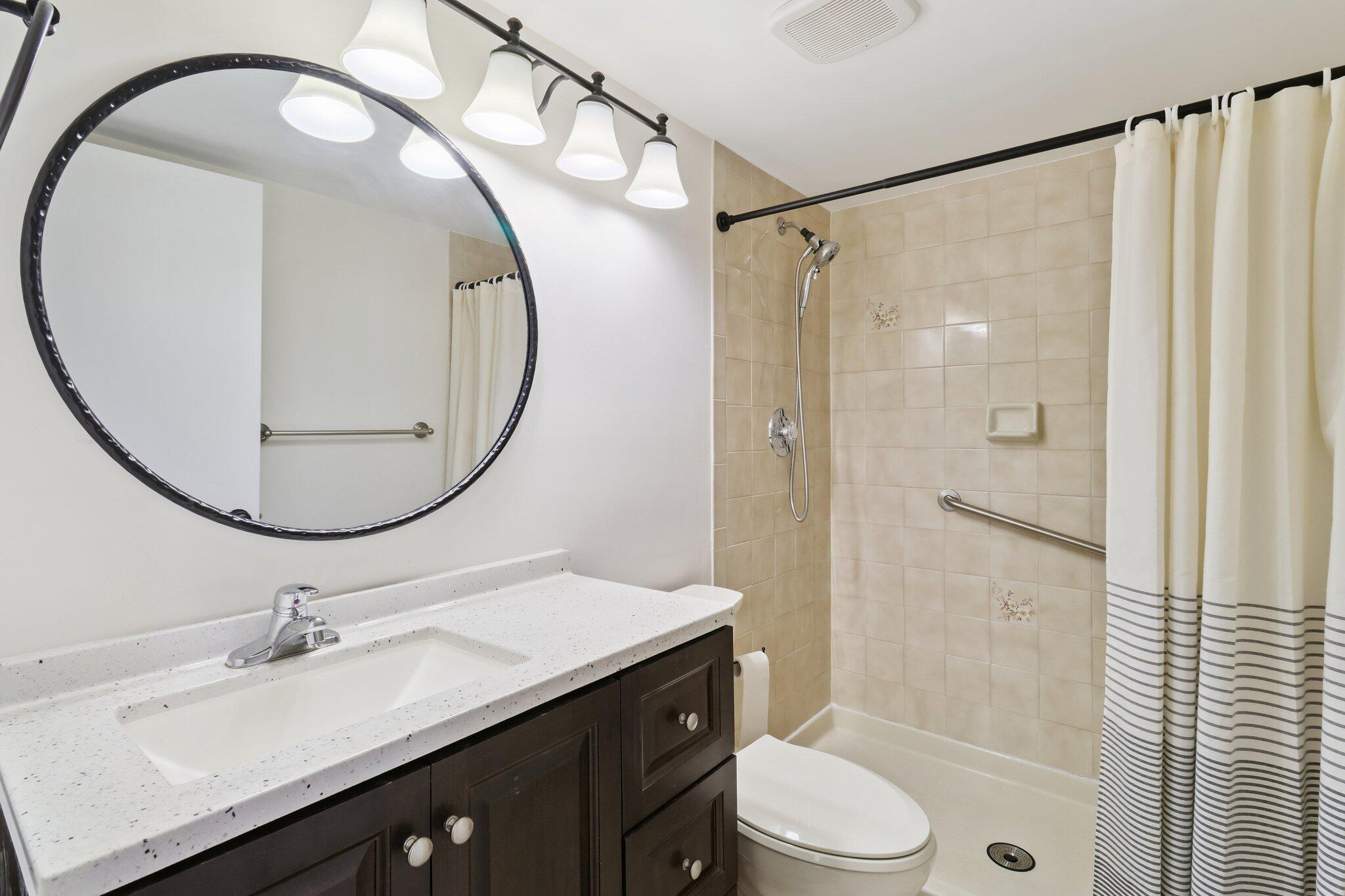 2500 Southeast Anchorage Cove, Unit D1 Port St. Lucie, FL 34952 - Photo 14 of 29 a bathroom with a sink and a mirror