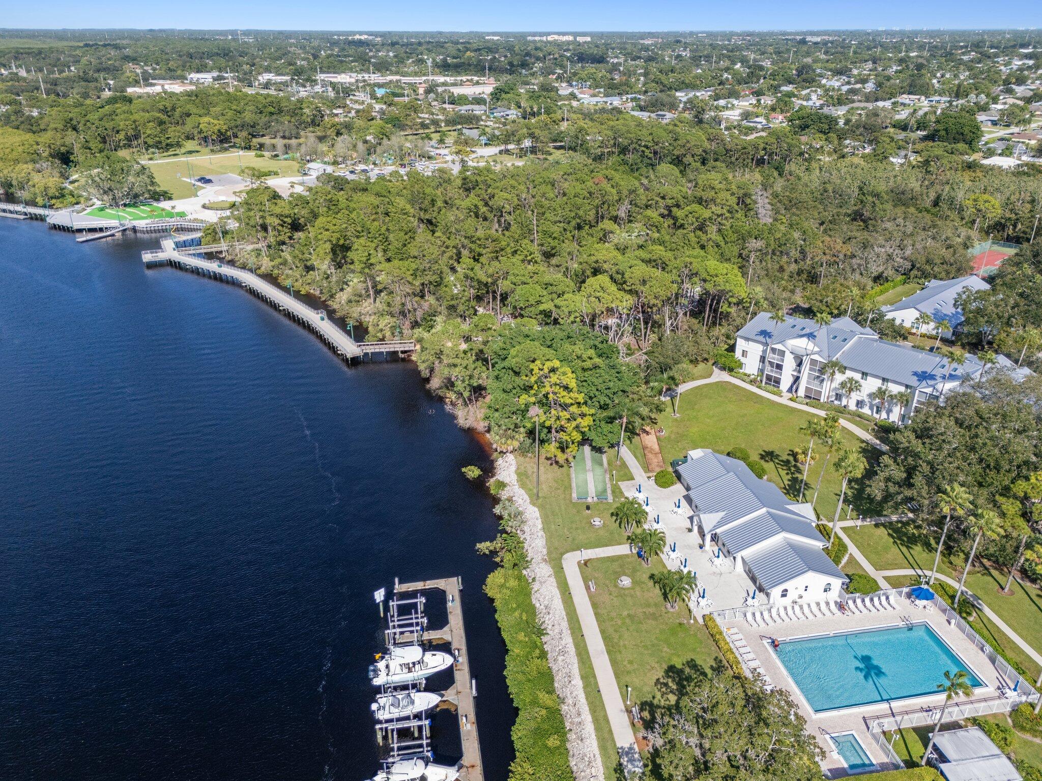 2500 Southeast Anchorage Cove, Unit D1 Port St. Lucie, FL 34952 - Photo 3 of 29 an aerial view of residential houses with outdoor space