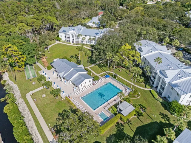 a view of a dining room with furniture and a chandelier