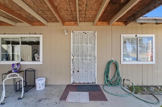 a view of an entryway with wooden floor