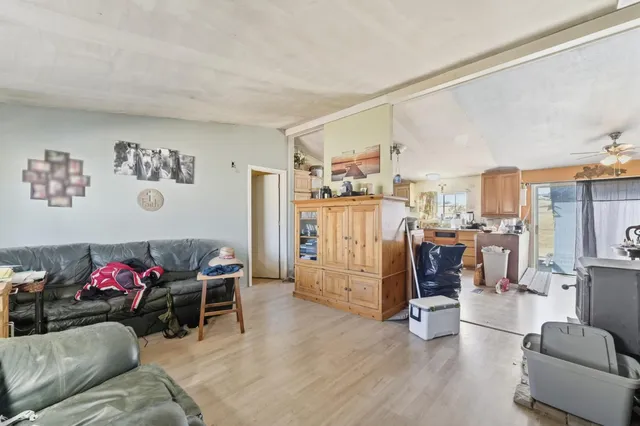 a view of a livingroom with workspace and a couch
